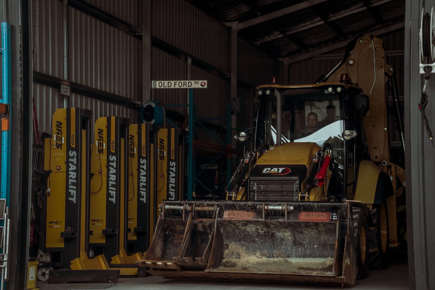Machine in shed with front bucket